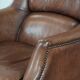 Cognac brown cow leather armchair with decorative nail finish