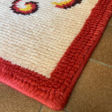 Vintage wool rug with floral decor