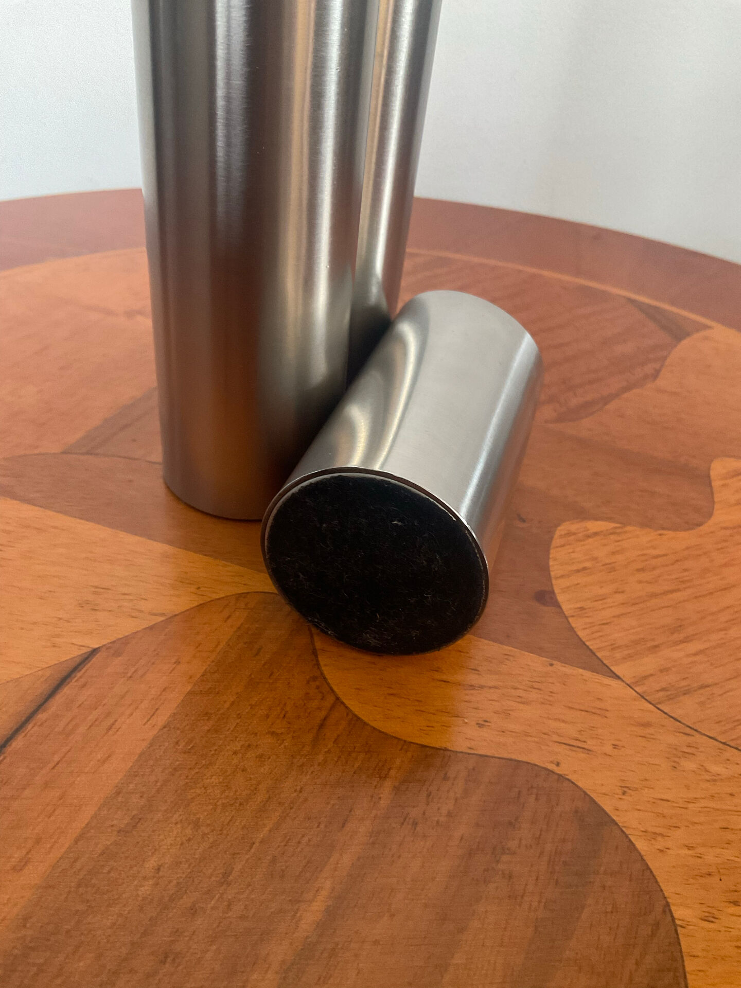 Vintage trio of brushed stainless steel candle holders