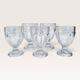 Set of 5 stemmed glasses made of pressed moulded glass.