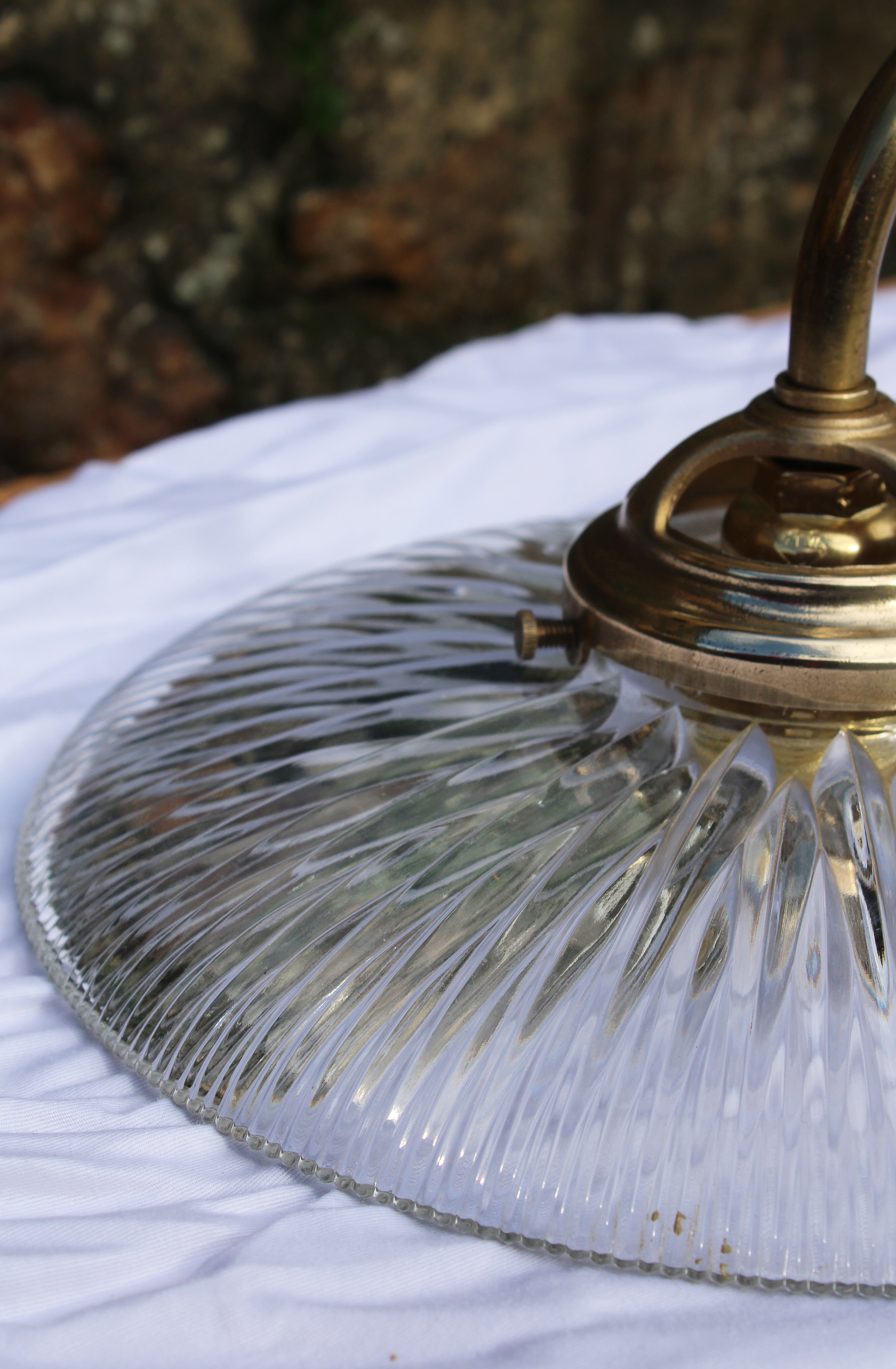 Holophane glass and brass wall light