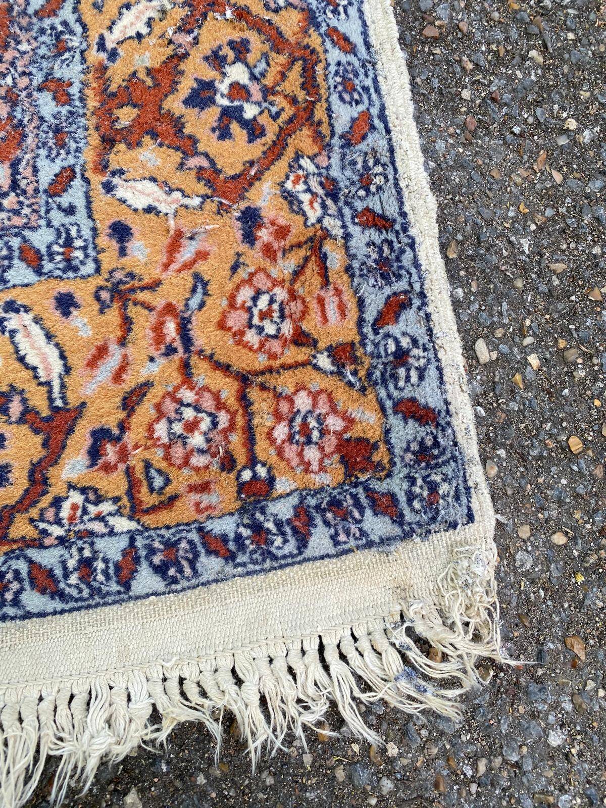 Handmade Persian rug in blue, beige, burgundy, and orange, 95x160cm.
