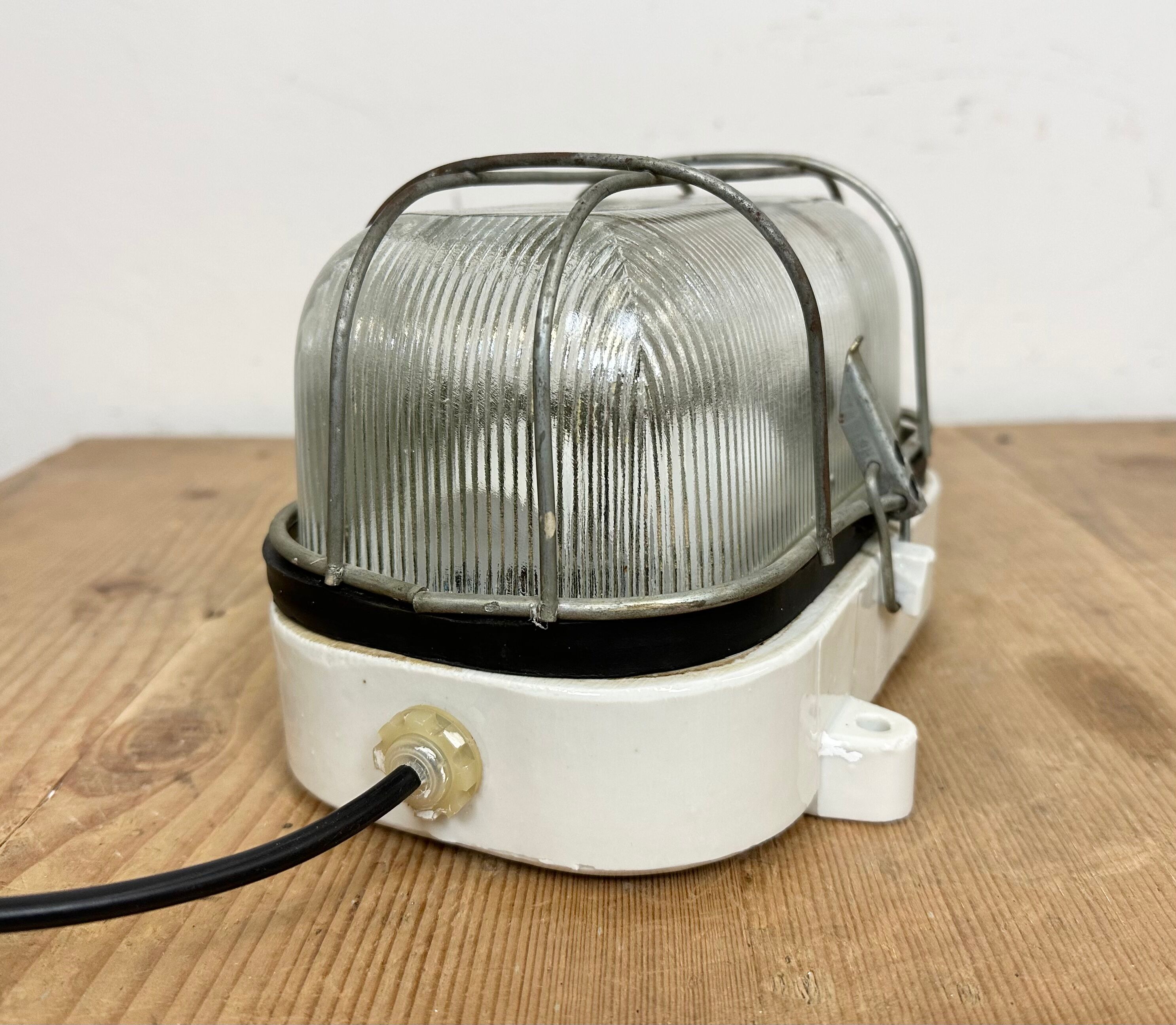 Industrial white porcelain cage wall light with ribbed glass, 1970s