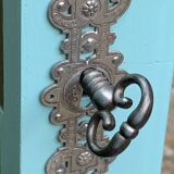 Beveled mirror on turquoise Parisian door