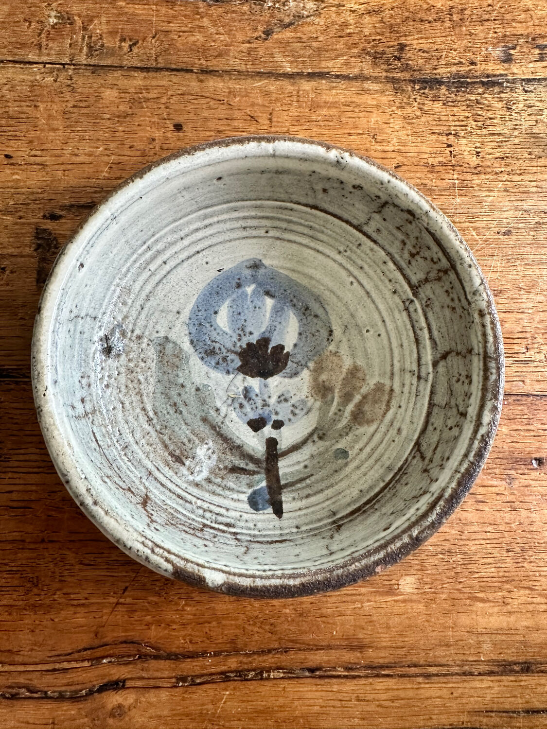 Enamelled red earth cup decorated with flowers. Gustave Reynaud.