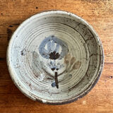 Enamelled red earth cup decorated with flowers. Gustave Reynaud.