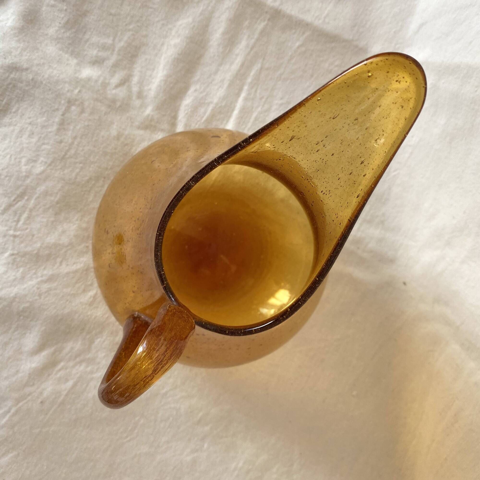 Blown glass jug with caramel bubbles
