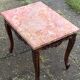 Carved wooden coffee table with shell pattern and removable pink marble top, old