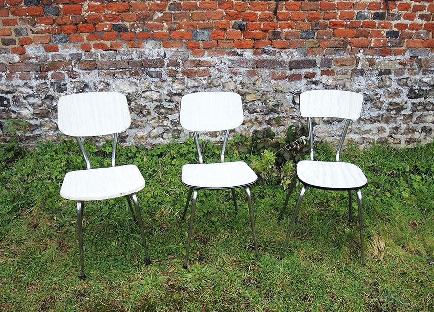 3 old white Formica chairs