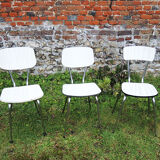3 old white Formica chairs
