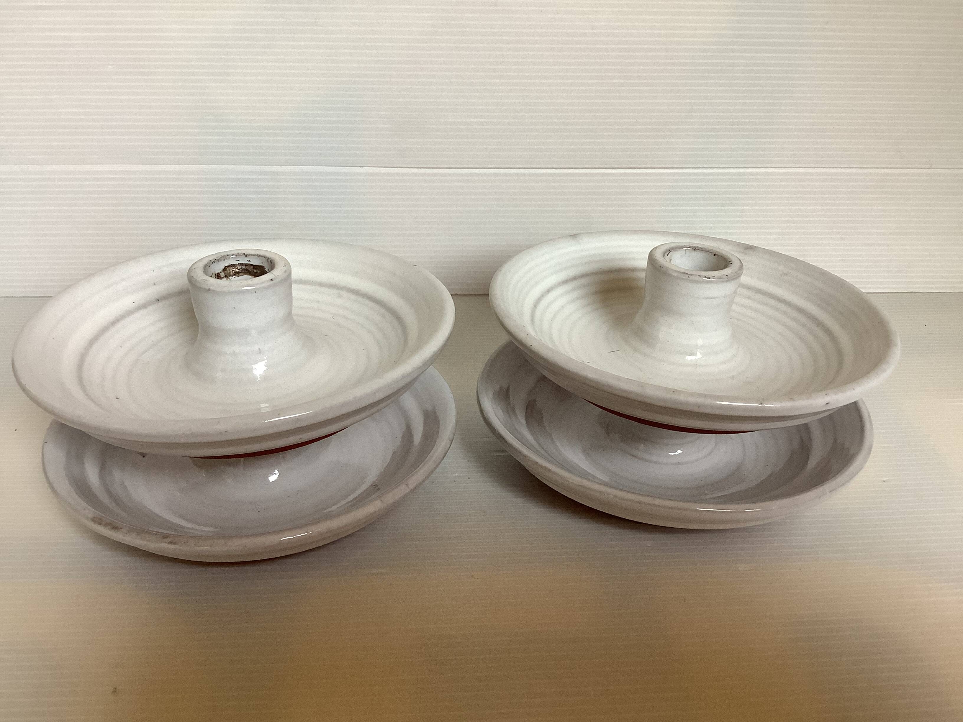 Four ceramic candle holders