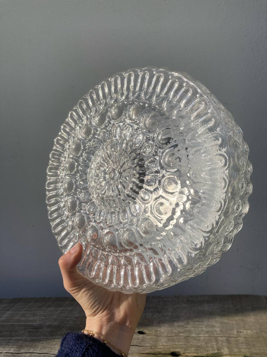 Pair of transparent round glass wall lights