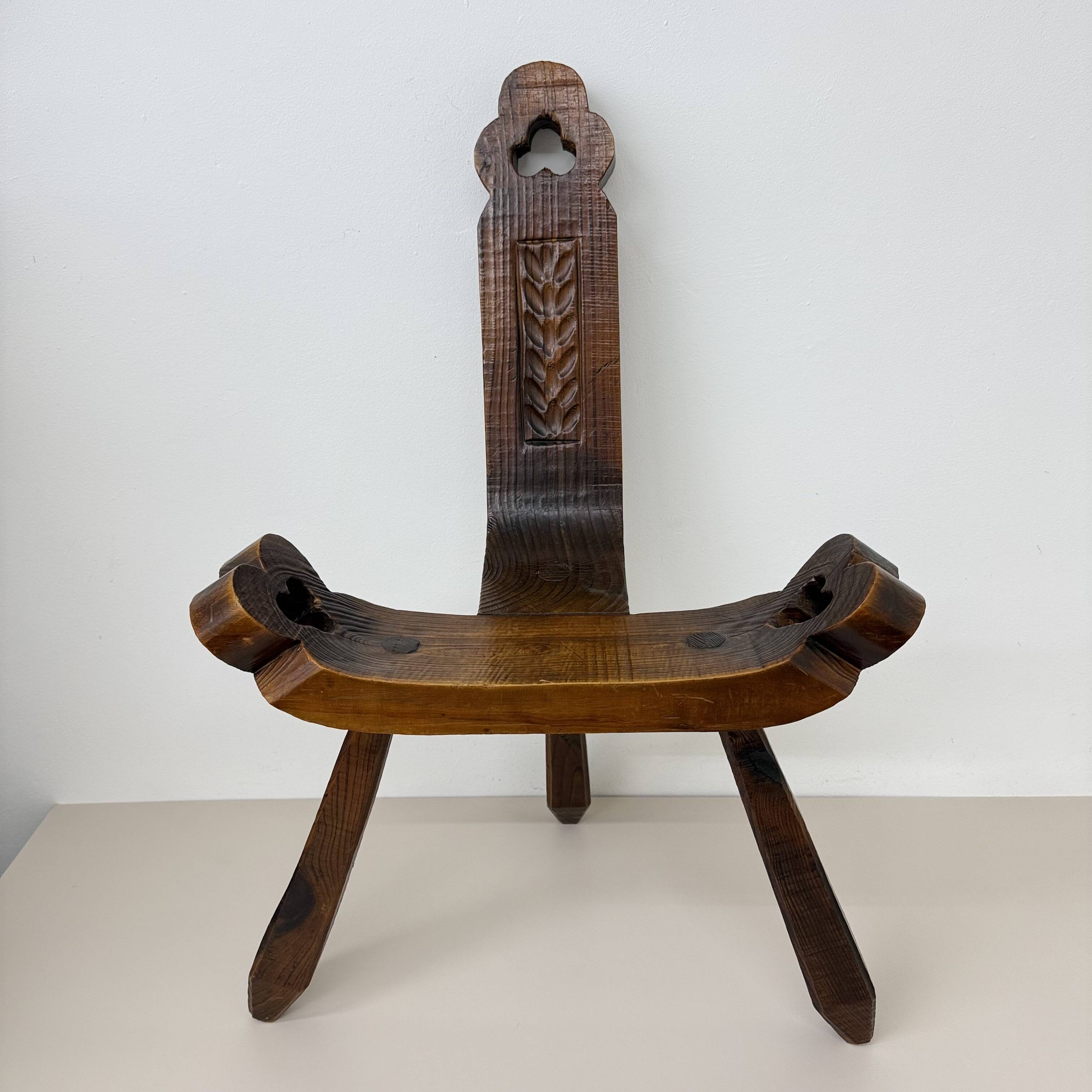 Brutalist hand carved oak Spanish tripod chair , 1970s