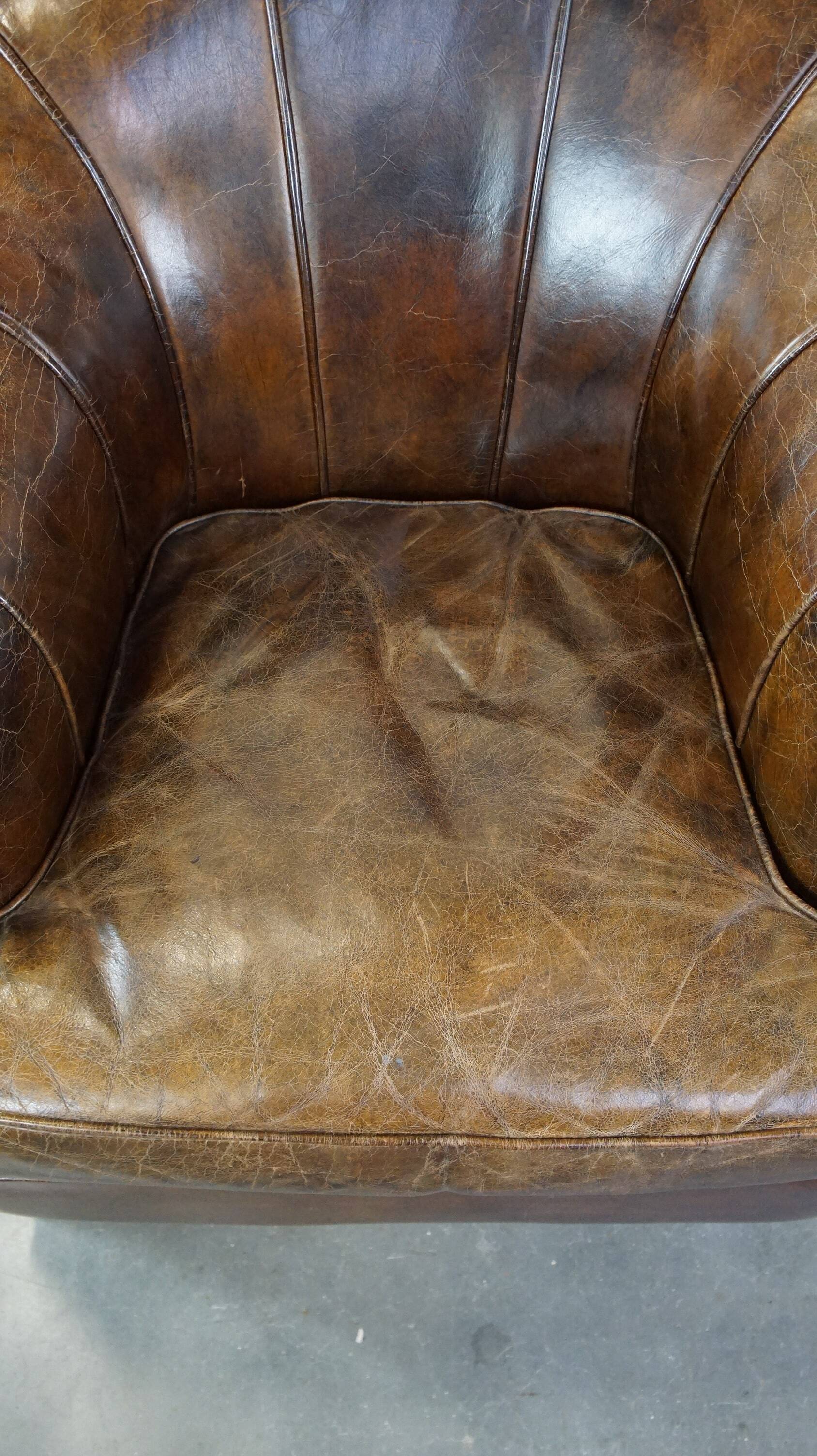 Stylish armchair with a unique design and beautiful finish, made of leather