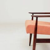 Mid-century modern armchair in coral red designed by H. Lis.