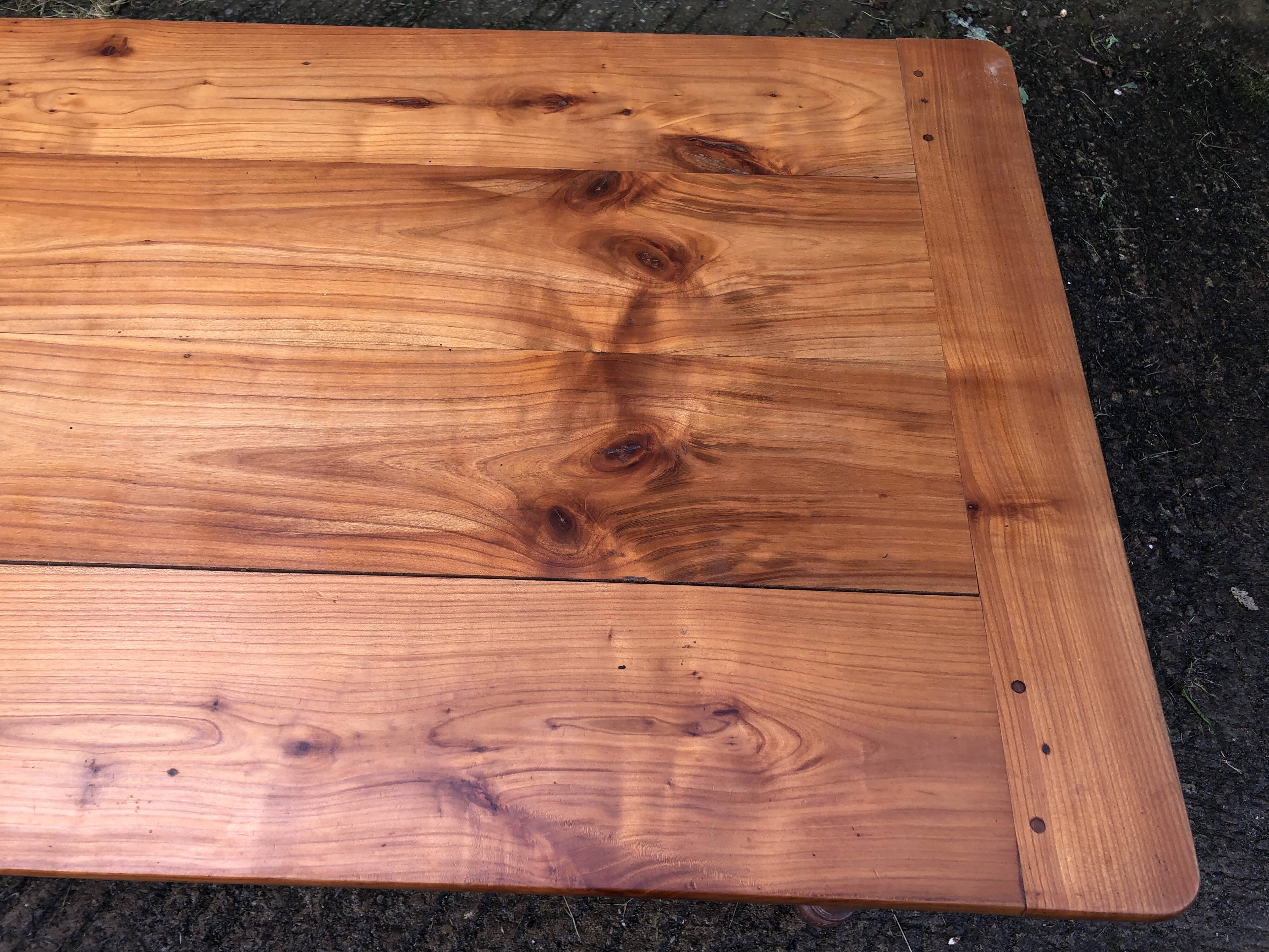Antique farmhouse table in solid cherry wood in Louis Philippe style.