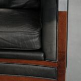 Black Art Deco cowhide leather and wooden design armchair with a high back