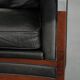 Black Art Deco cowhide leather and wooden design armchair with a high back