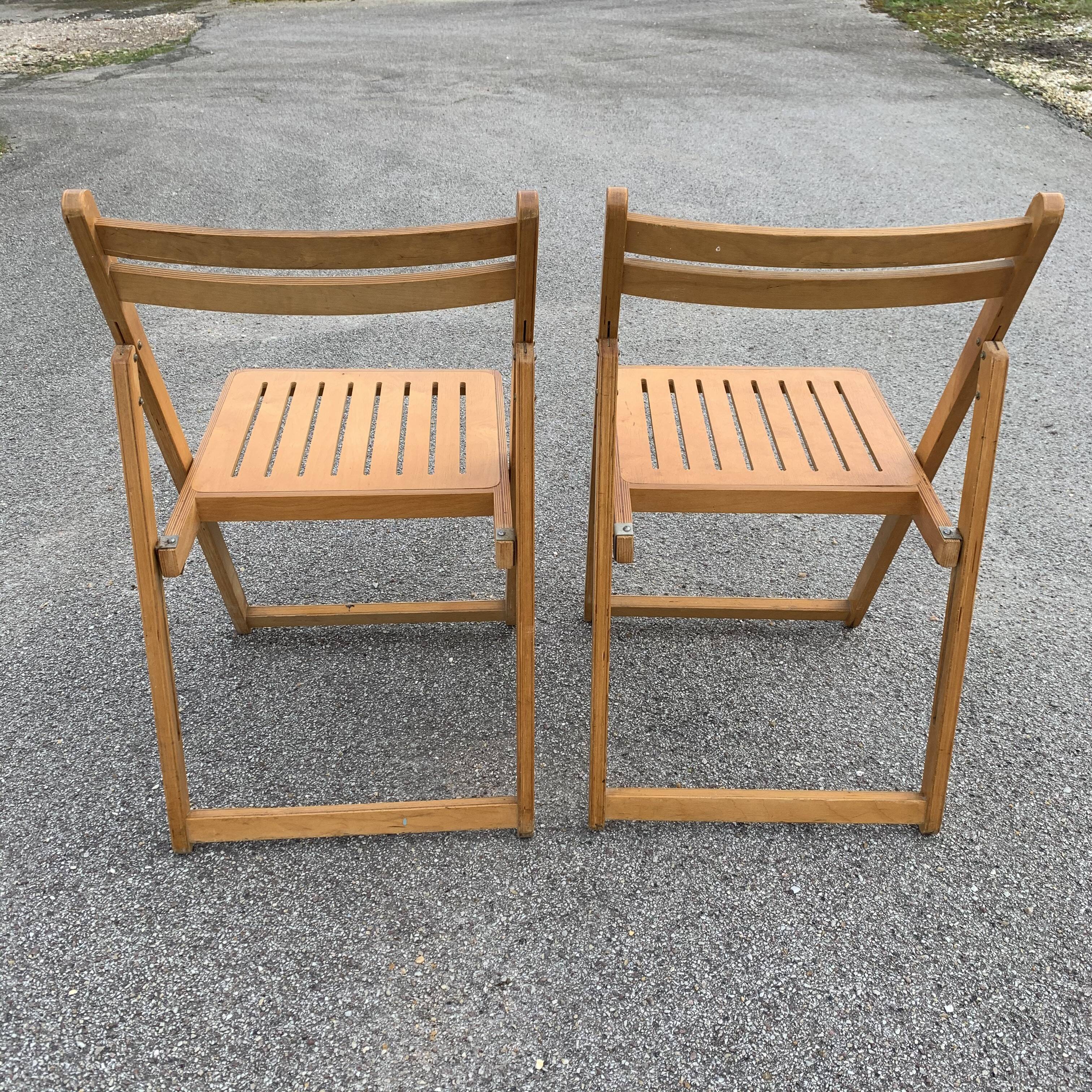 Pair of folding wooden chairs