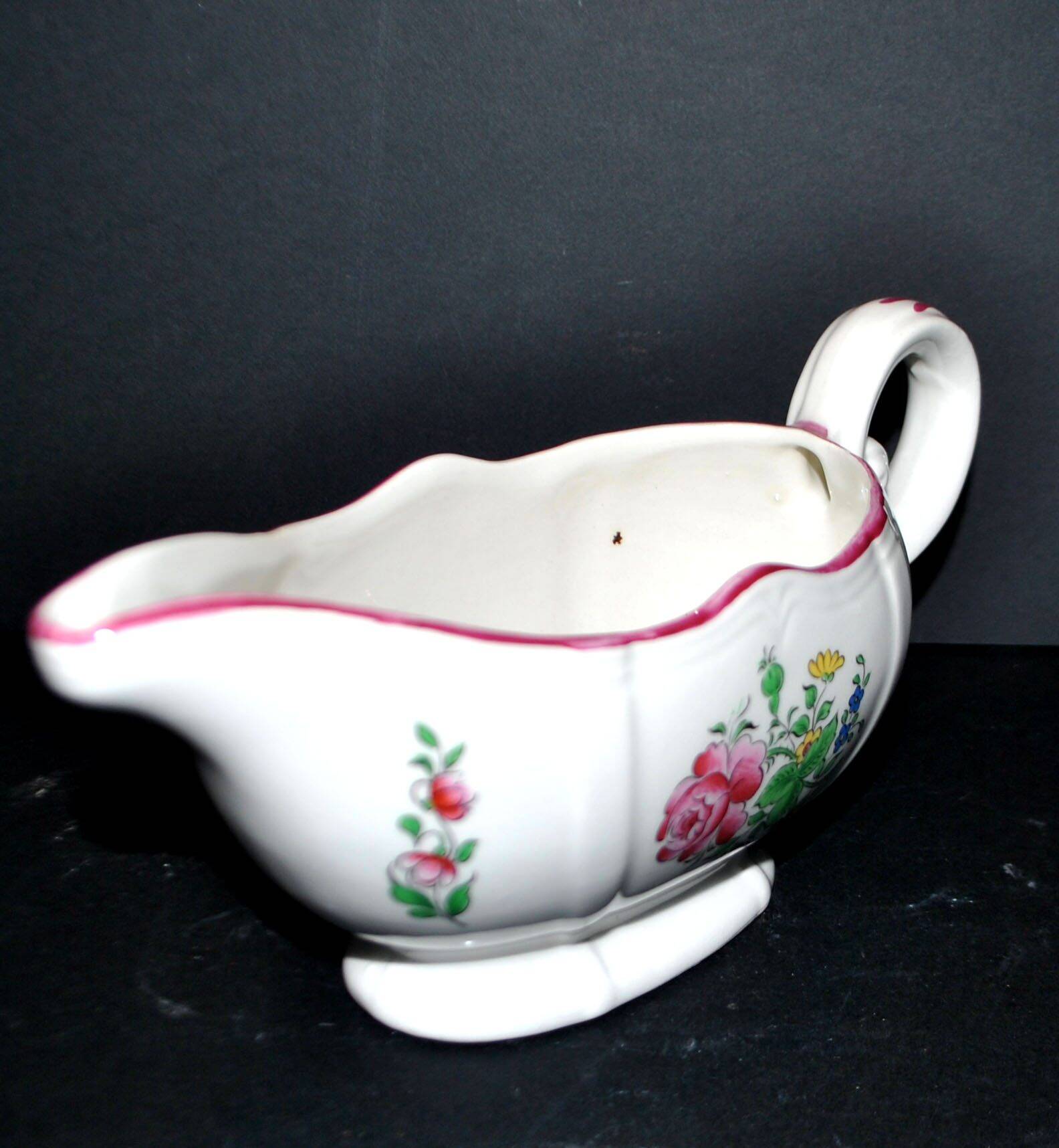 Lunéville KG earthenware sauce boat with polychrome painted flowers, revolving lamp.