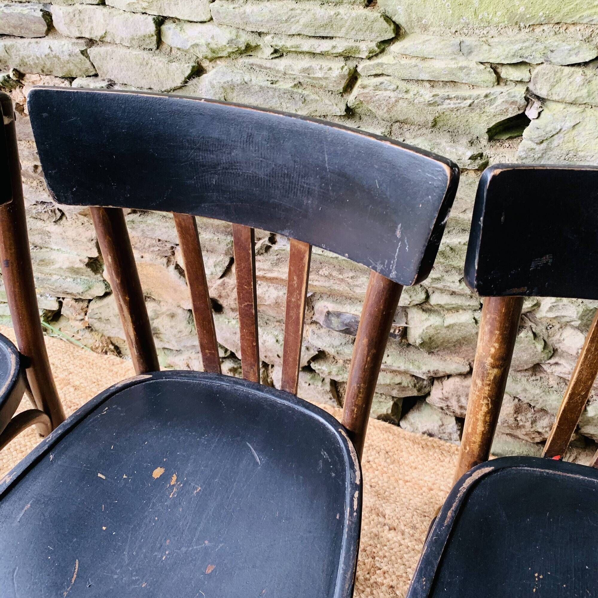 Set of four vintage bentwood bistro chairs.