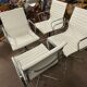 Suite de 4 fauteuils en cuir blanc Ray et Charles Eames