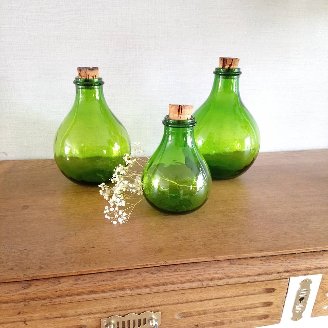 3 green glass bottles
