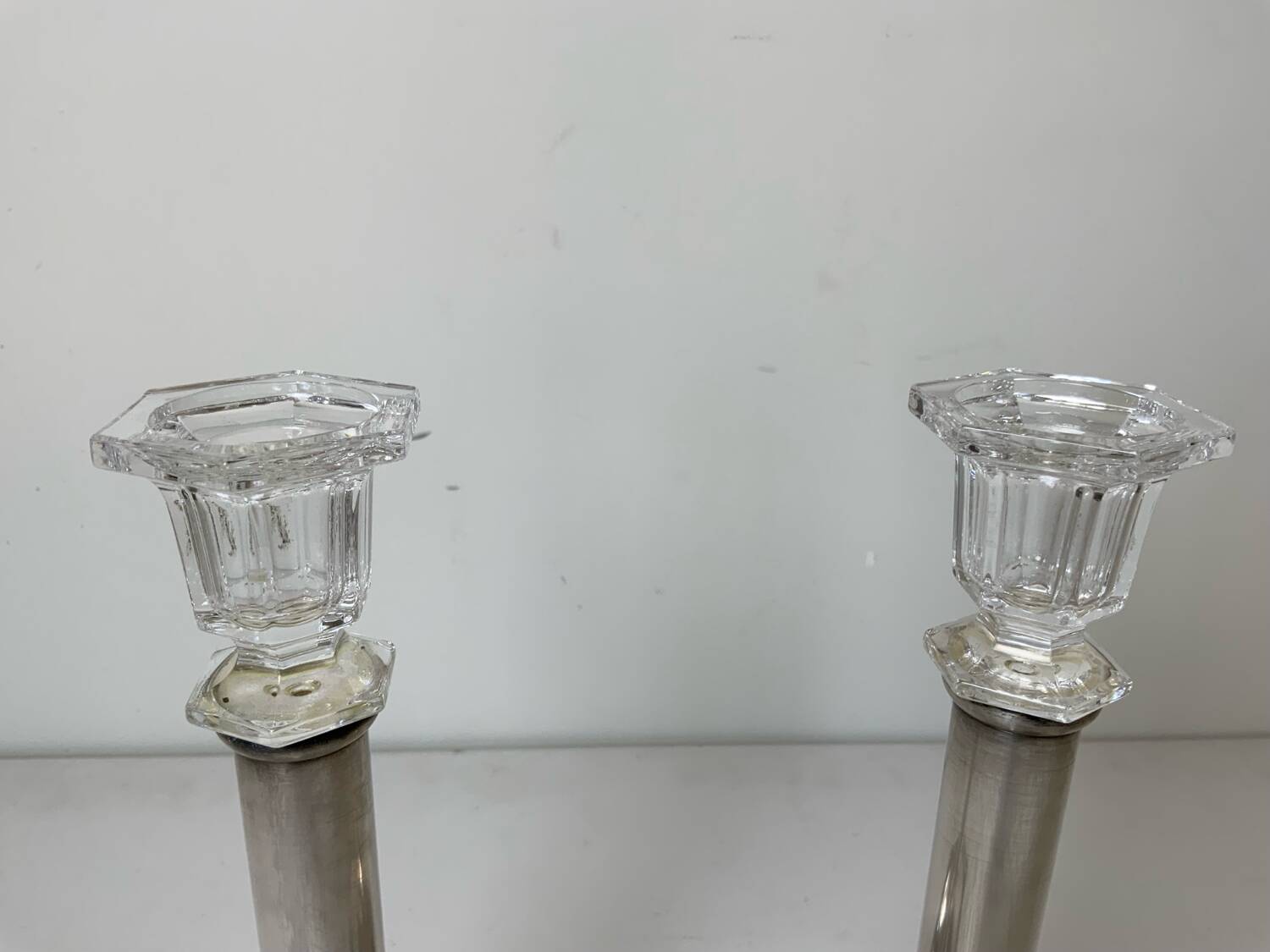 Pair of silver-plated metal candlesticks