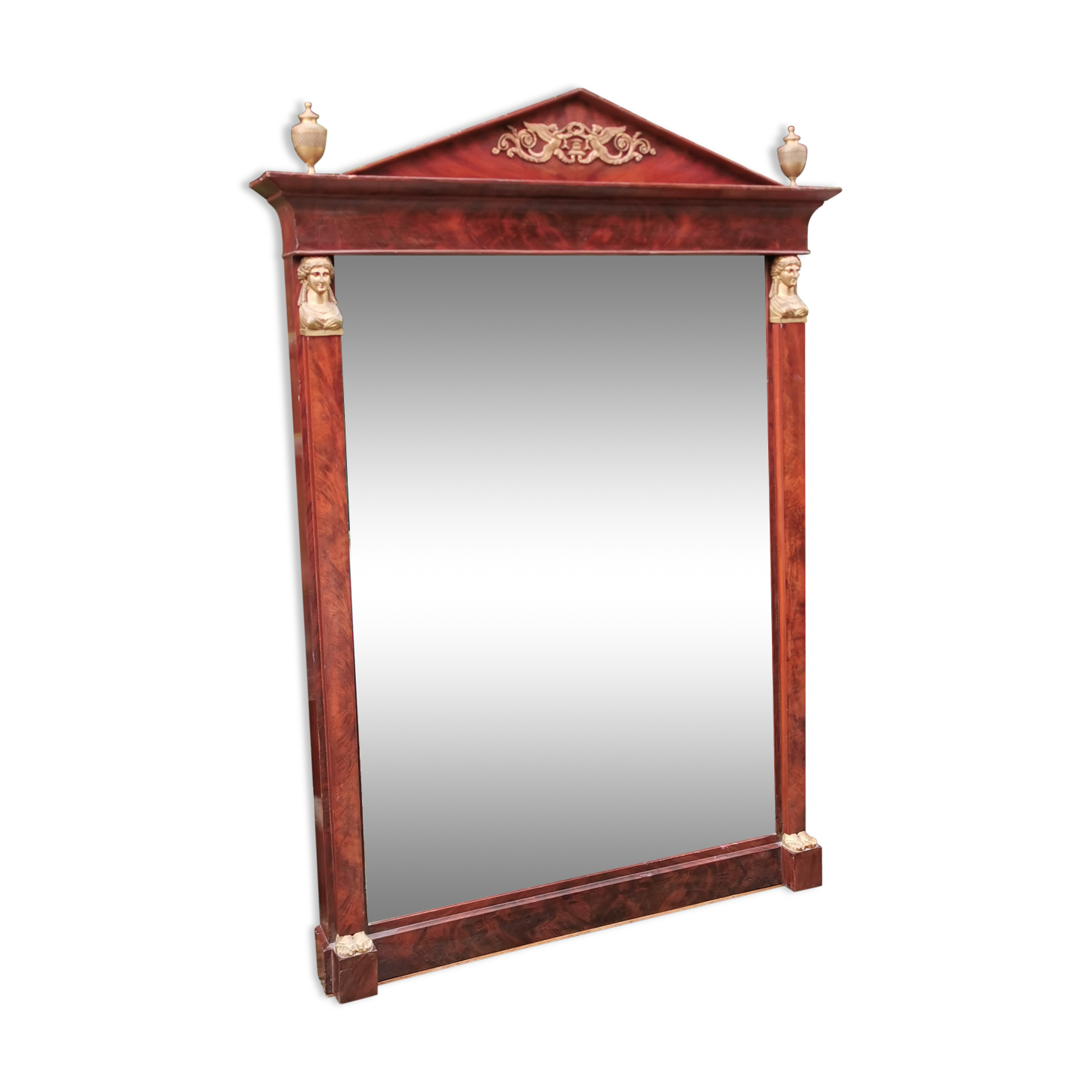 Mahogany pediment mirror with Empire-style cariatids. Return from Egypt
