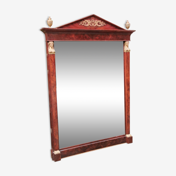 Mahogany pediment mirror with Empire-style cariatids. Return from Egypt
