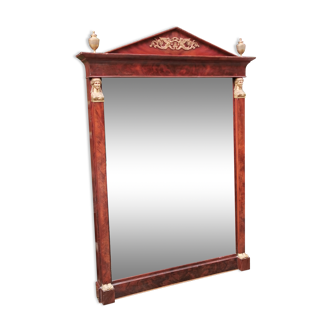 Mahogany pediment mirror with Empire-style cariatids. Return from Egypt