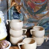 Six vintage potter's ceramic cups with vanilla enamel