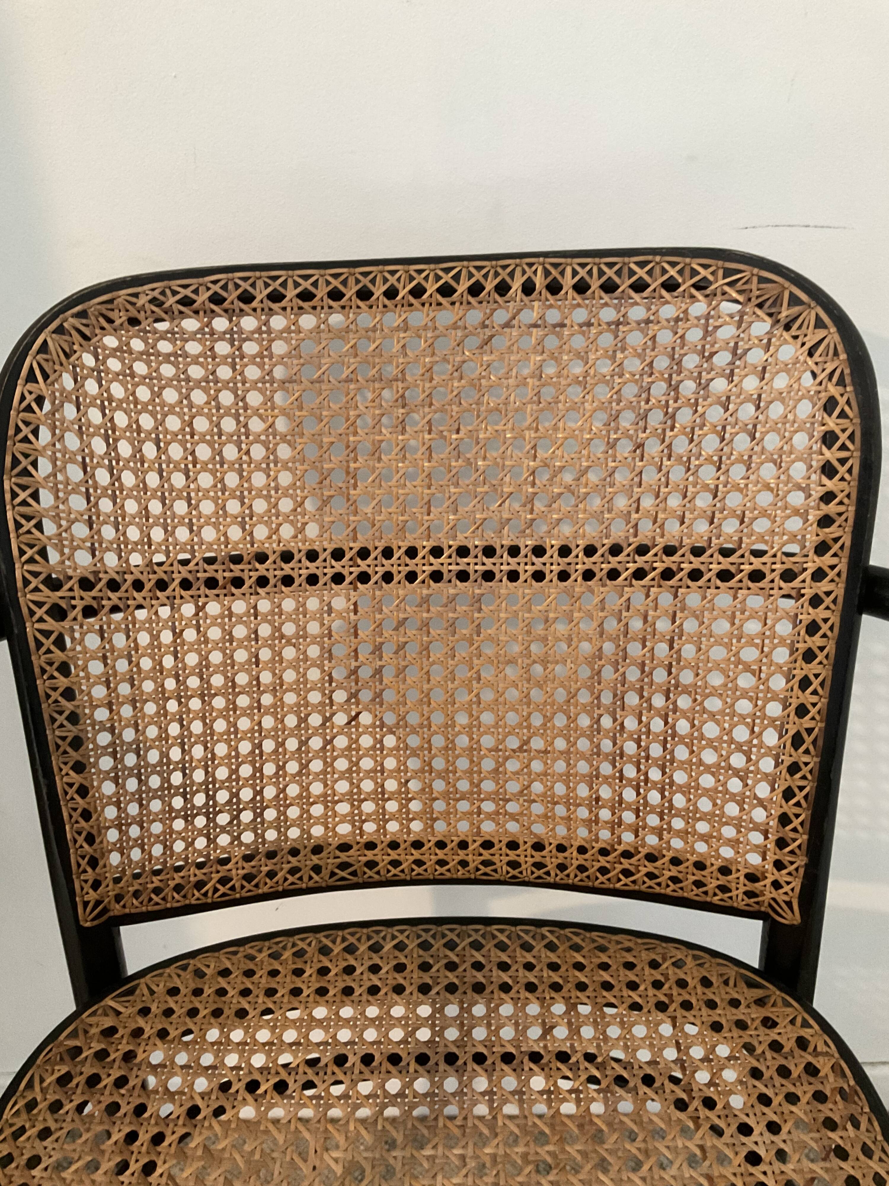 Canned bistro armchair and curved wood from the 60s