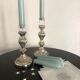 Pair of mercerized candle holders