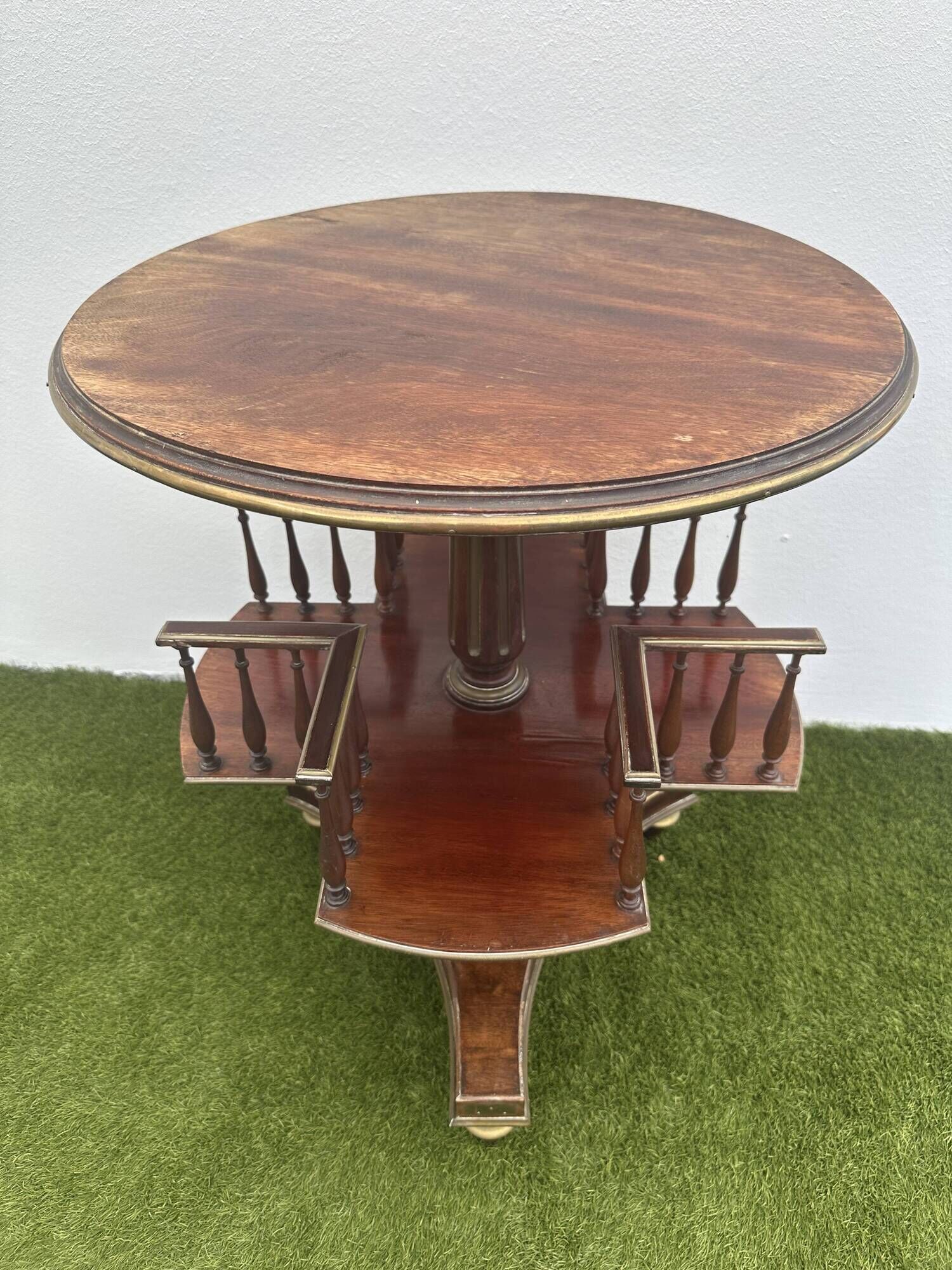 Old round and revolving wooden and brass library