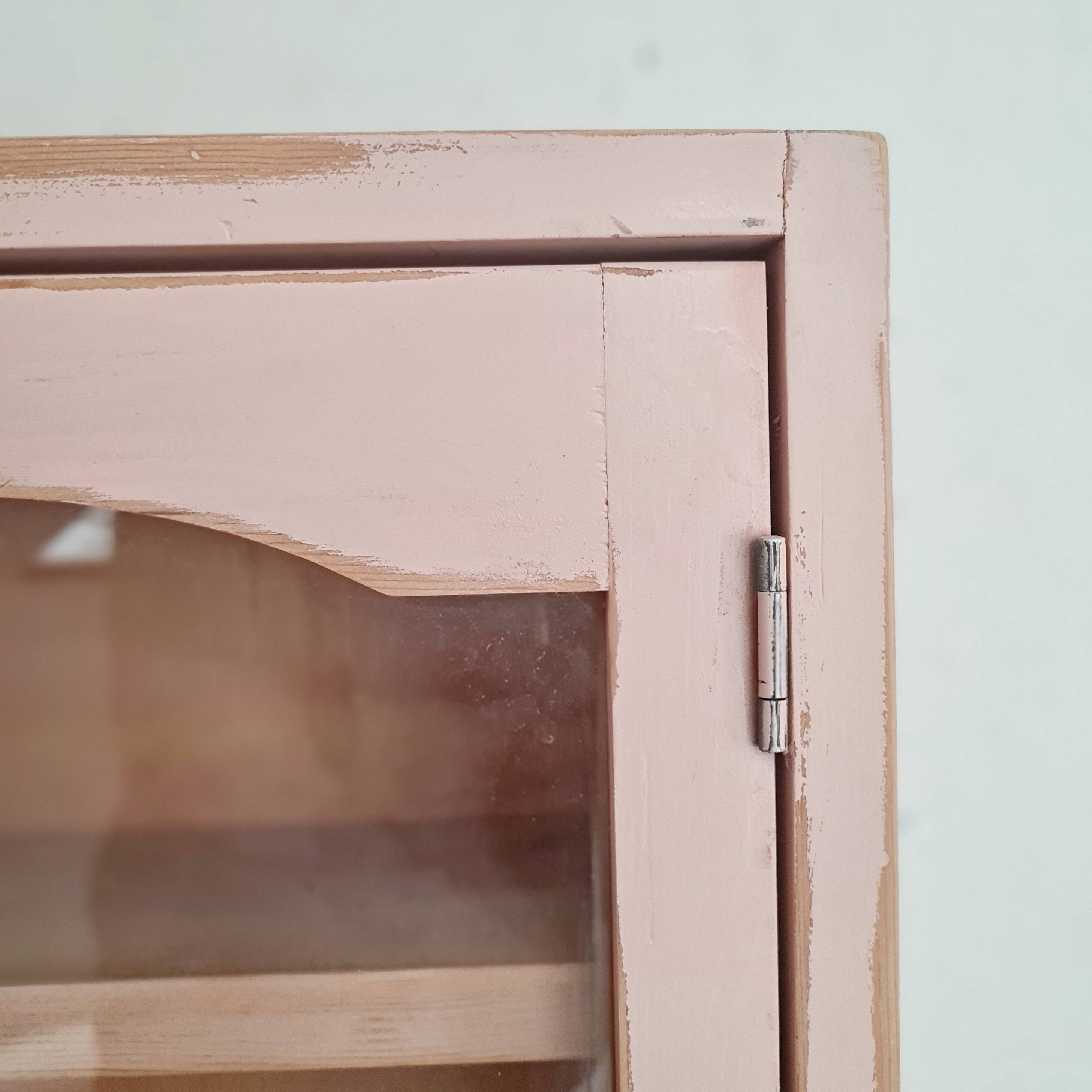 Medicine cabinet in patinated pink wood