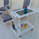 Pair of ottoman armchairs with wrought iron serving trolley, vintage garden, old design