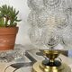 Antique globe table lamp in moulded transparent glass with a brass base.