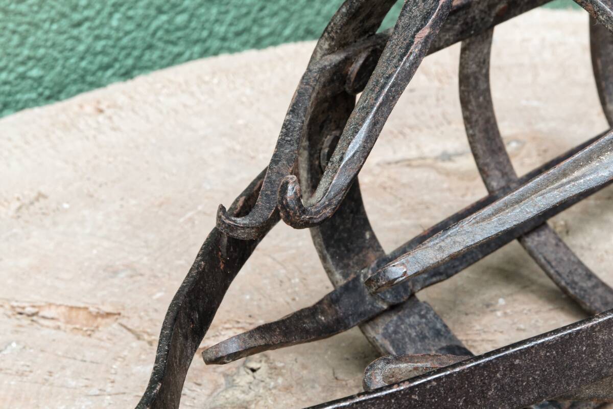 Riveted wrought iron cage suspension