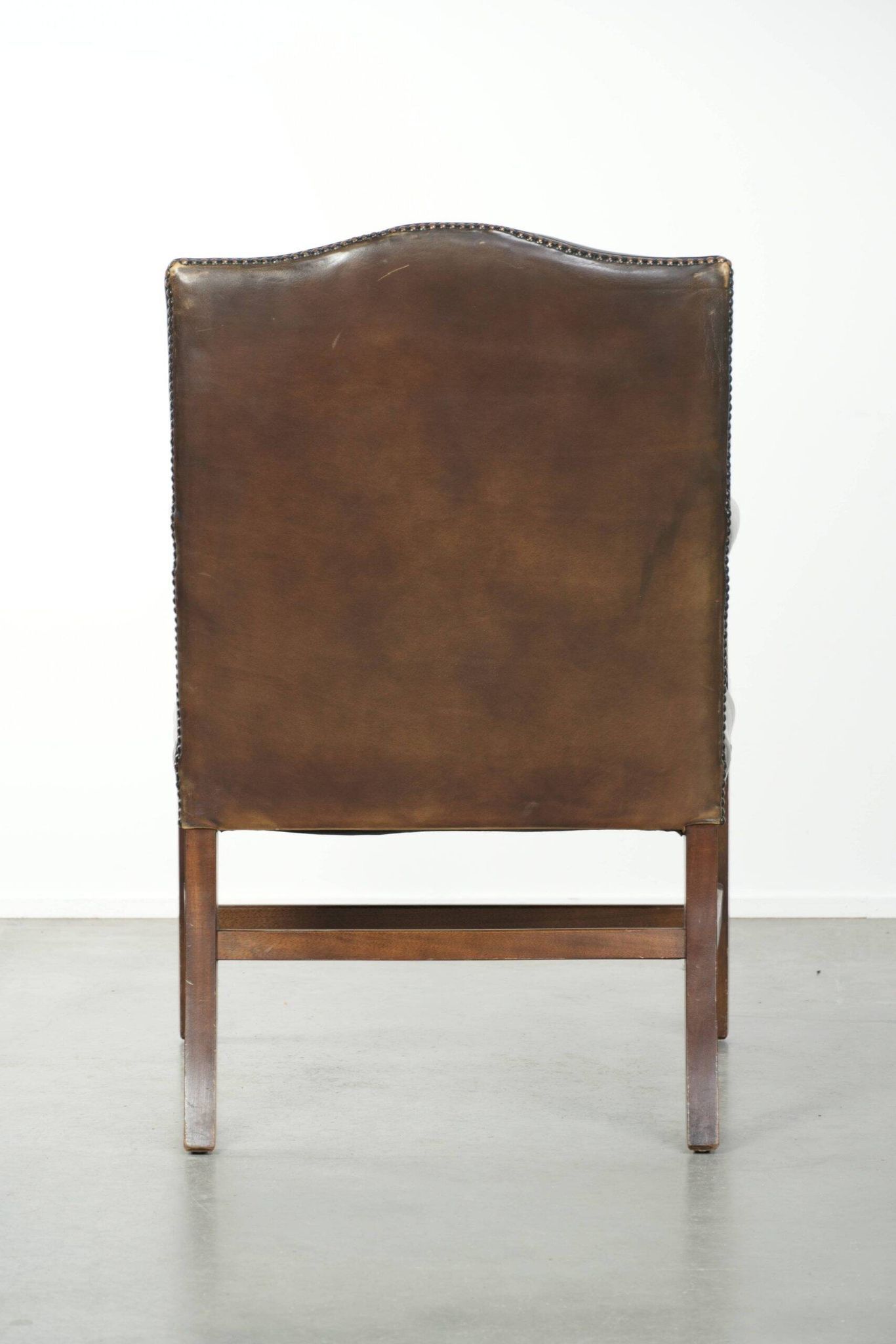 Wooden cow leather English Gainsborough chair with a stunning appearance