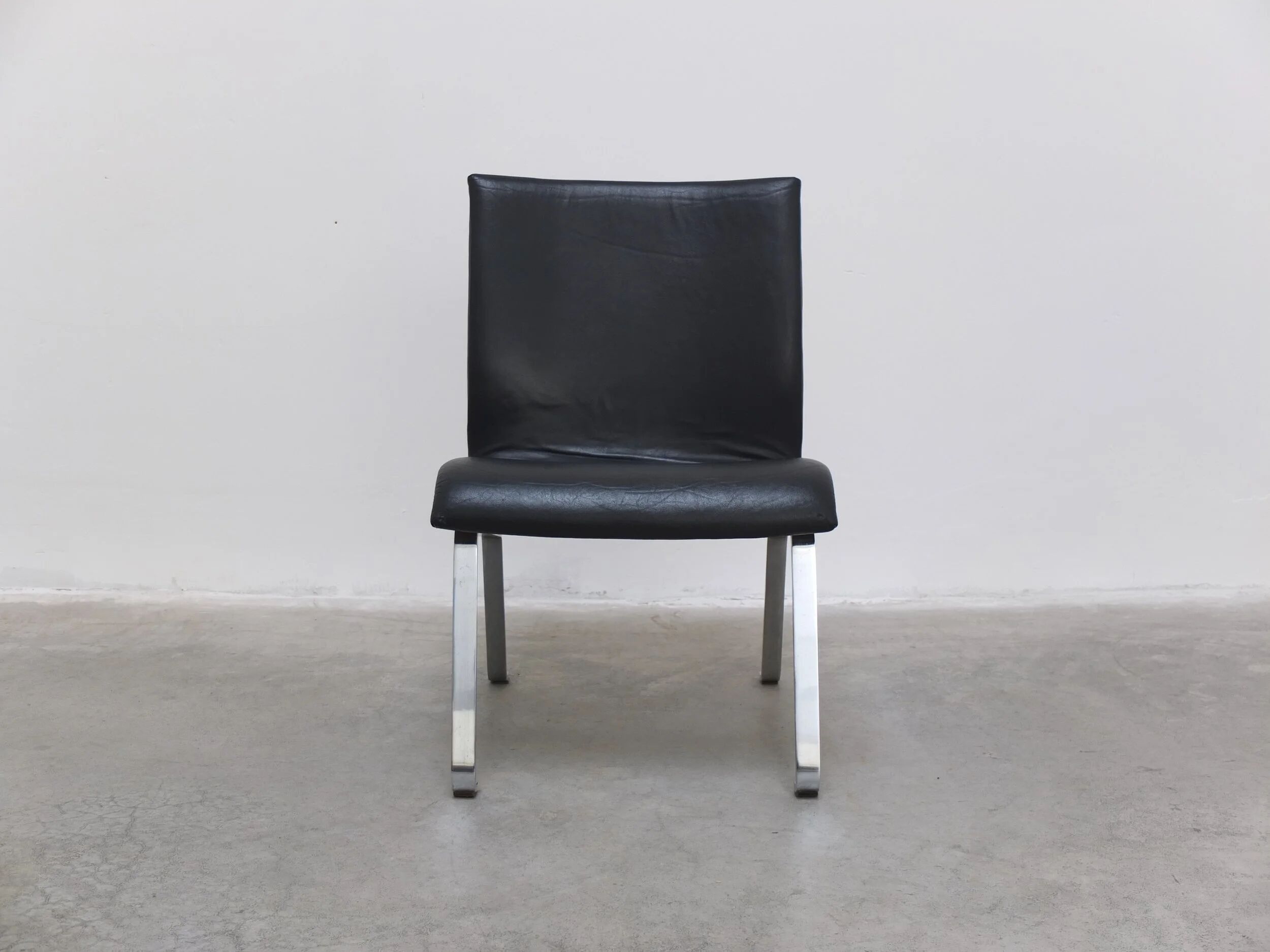 Unique black leather & steel modernist lounge chair, 1960s
