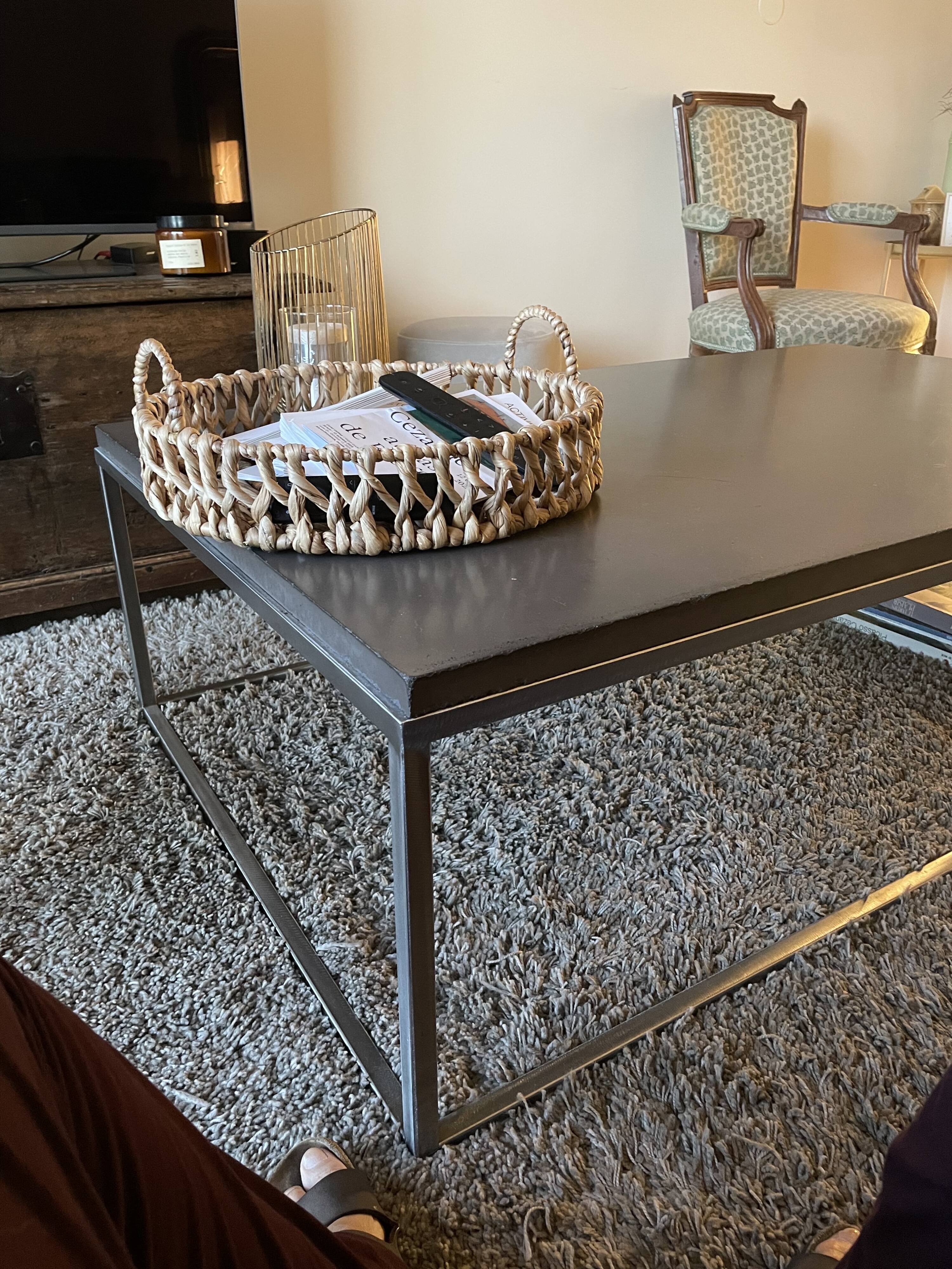 Coffee table in stone and brushed steel