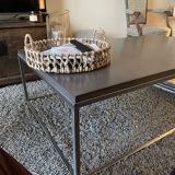 Coffee table in stone and brushed steel
