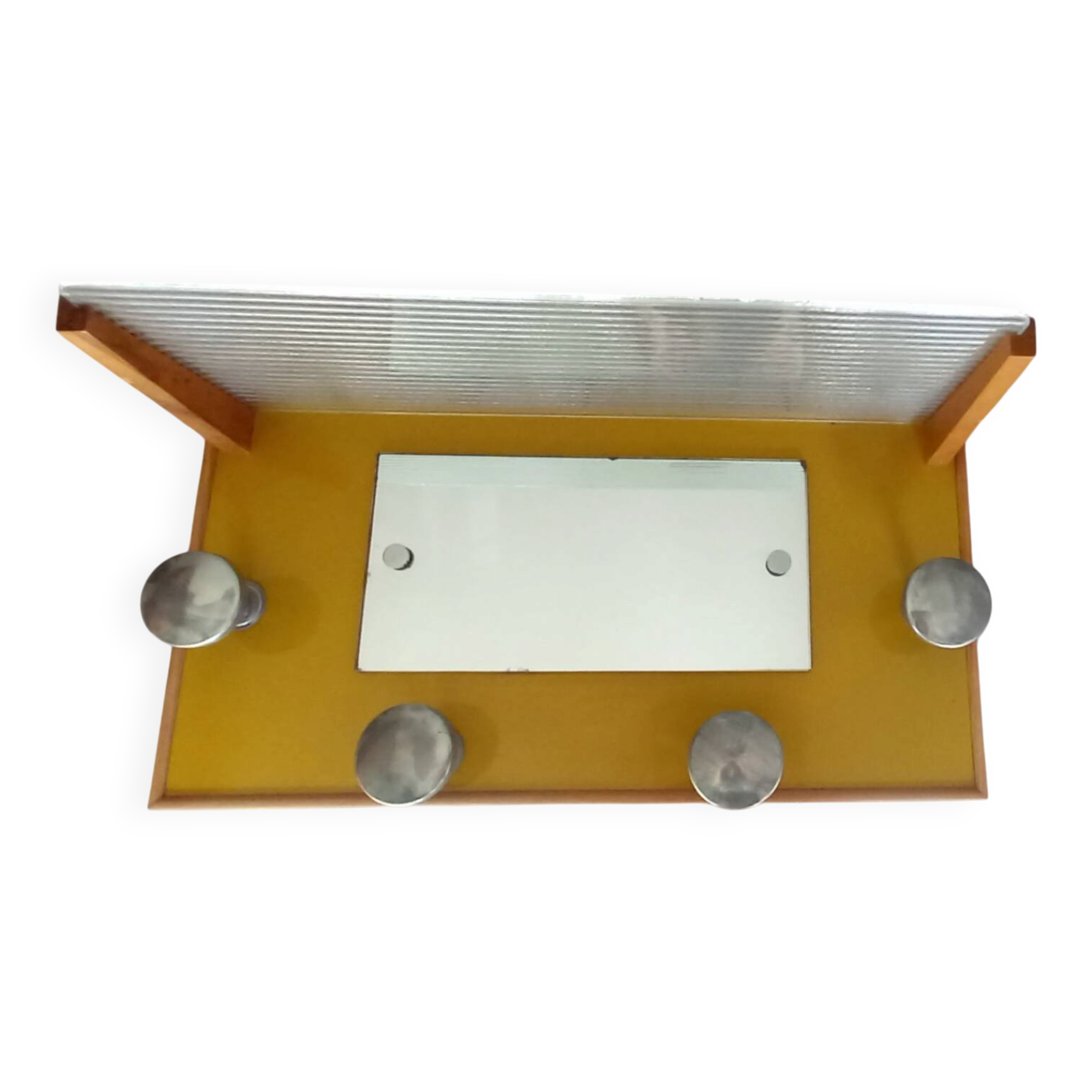 1950s coat rack with mirror, metal hooks, and glass shelf.
