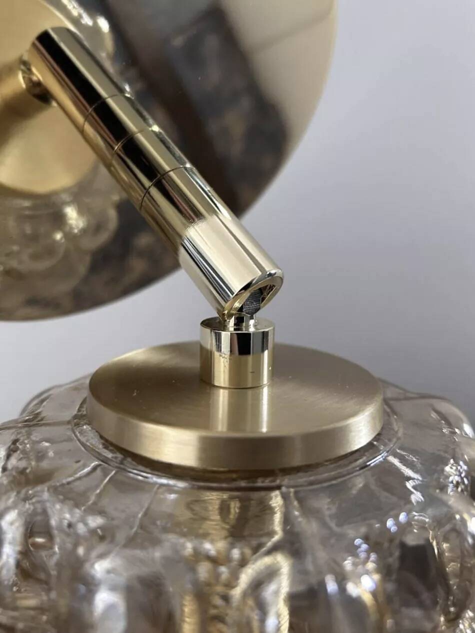 Gold tilting wall light