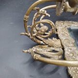 Repousse brass wall mirror with three candles, beveled glass, end of 19th century, double eagles