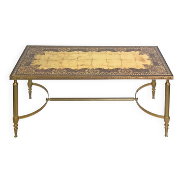 Coffee table in gilded brass with a mirrored eglomisé glass top.