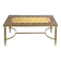 Coffee table in gilded brass with a mirrored eglomisé glass top.