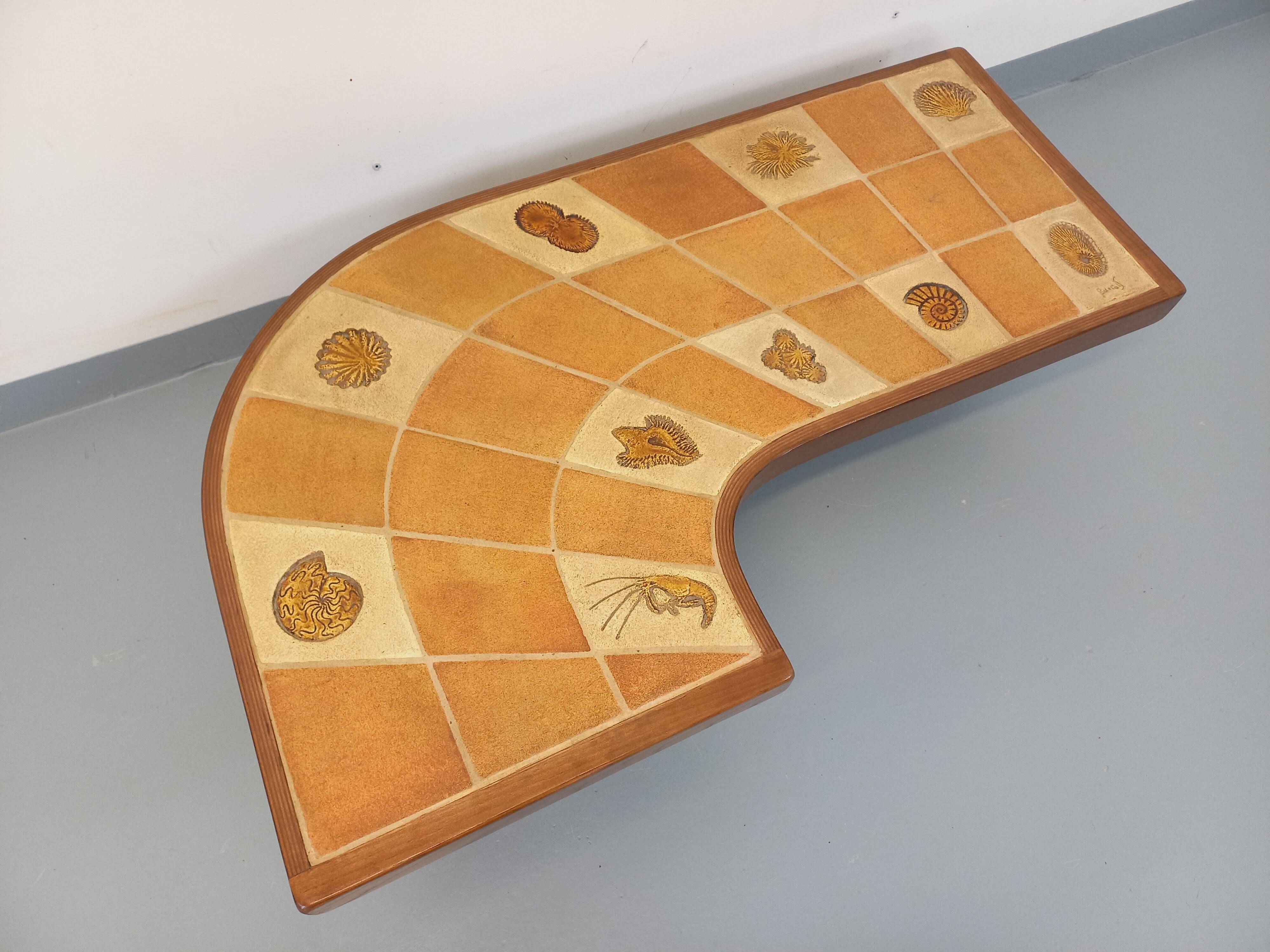 Barrois vintage shell-patterned comma coffee table in wood and ceramic.