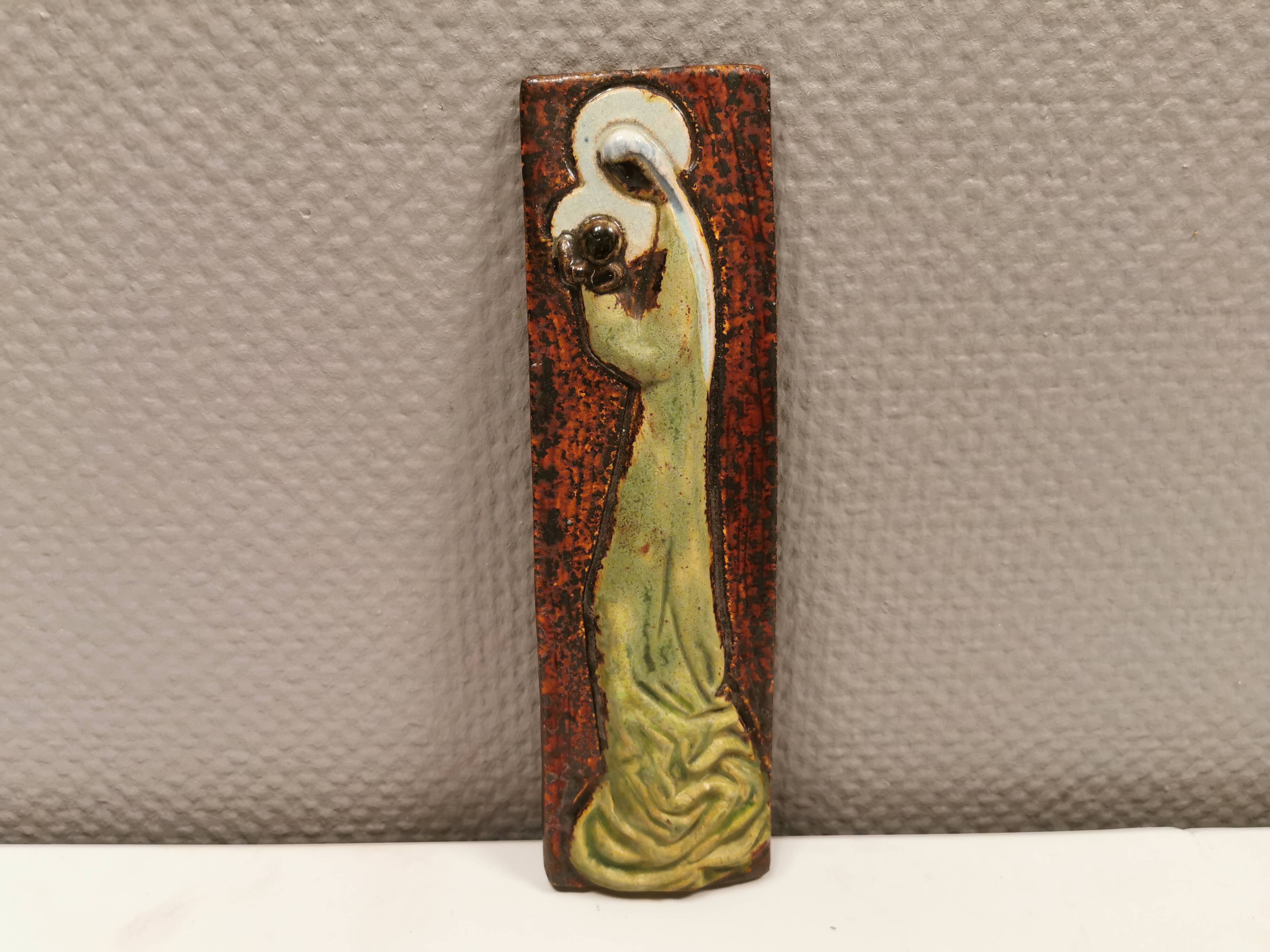 Slim relief with a motif of Madonna and child.